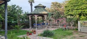 a gazebo in the yard of a house at Anna 2 in Kobuleti