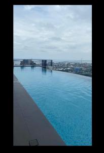 a large swimming pool on top of a building at Calyx Residences 18i in Cebu City