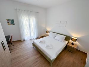 Postel nebo postele na pokoji v ubytování Dar Sara Gozo