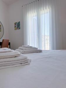 Postel nebo postele na pokoji v ubytování Dar Sara Gozo
