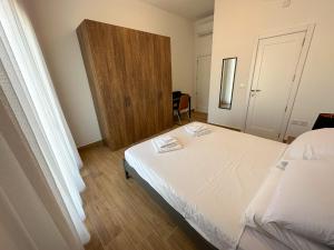 Postel nebo postele na pokoji v ubytování Dar Sara Gozo