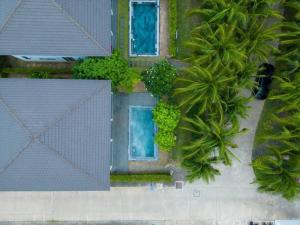an overhead view of a building with two swimming pools at Anise villas in Phu Quoc
