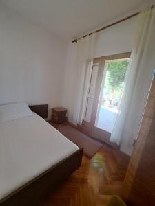 Postel nebo postele na pokoji v ubytování Apartman Grebaštica