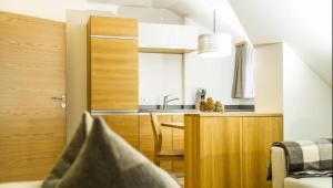 a small kitchen with a table and a dining room at Himmlisch Urlauben in Pichl in Schladming