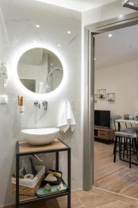 a bathroom with a sink and a mirror at Guest house (Gastouri) in Gastouri
