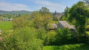 an aerial view of a house in a field at Villa Honorine in Saint-Honoré-les-Bains