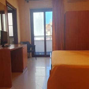 Postel nebo postele na pokoji v ubytování Hotel Ristorante Rinelli