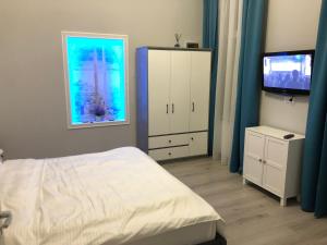 En eller flere senge i et værelse på Luxury Center City