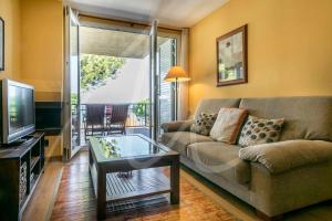 A television and/or entertainment centre at Xaloc by SeaMount Rentals