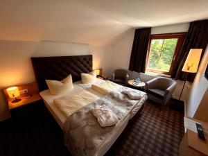 Postel nebo postele na pokoji v ubytování Augustusberg Hotel & Restaurant + 27 fotografií