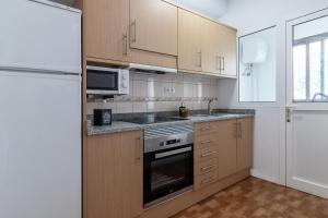 Kuchyň nebo kuchyňský kout v ubytování Flatguest La Herradura