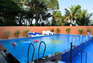a swimming pool with a ball in the middle at Haveli Backwater Resort in Alleppey