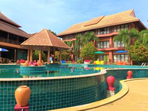a resort swimming pool with a resort at Andamanee Boutique Resort Aonang Krabi - Free Beach Shuttle - SHA Extra Plus in Ao Nang Beach