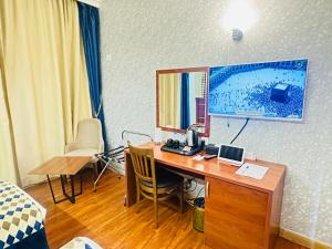 TV a/nebo společenská místnost v ubytování Nusk Al Madinah