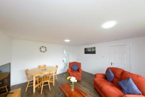 a living room with a couch and a table at Premier Apt - Bridge View-Rosyth in Rosyth