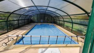 an overhead view of a swimming pool in a tunnel at DOMAINE DES GRAVIERS in Plainfaing