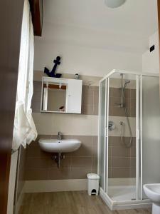 a bathroom with a sink and a shower at A Paranza in Curtatone