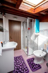 a bathroom with a shower and a sink and a toilet at Casa de Vacanță S&B in Braşov