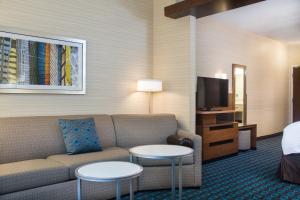 a living room with a couch and two tables at Fairfield Inn & Suites by Marriott Dayton in Dayton