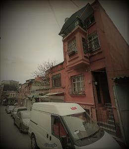 a white van parked in front of a building at Men's Hostel in Fatih, Istanbul in Istanbul