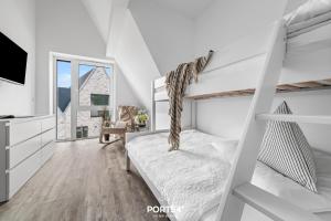 Voodi või voodid majutusasutuse Ferienhaus Inselloft Fehmarn toas