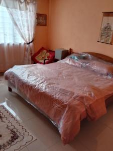 Postel nebo postele na pokoji v ubytování CHALET WARISAN SINERGI