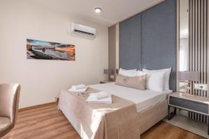 Postel nebo postele na pokoji v ubytování Dulamerovic Hotel
