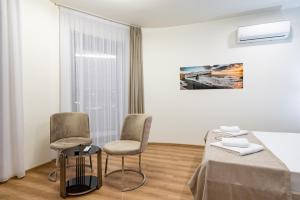 Postel nebo postele na pokoji v ubytování Dulamerovic Hotel