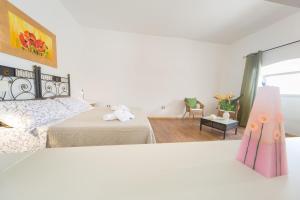A bed or beds in a room at Giardino Nascosto