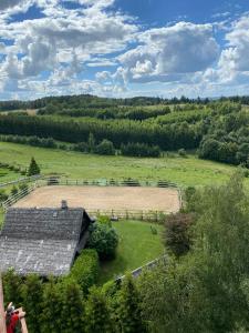 an aerial view of a farm with a barn at Mazurskie Energie dom ekologiczny całoroczny in Stare Juchy