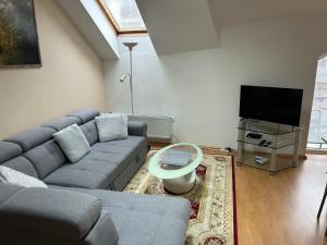 A television and/or entertainment centre at Kondé Apartments A