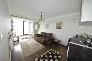 a living room with a couch and a rug at apartment in mudanya in Mudanya