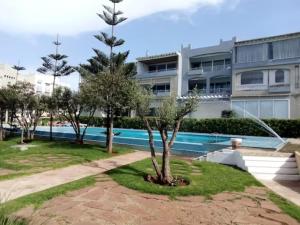 Kolam renang di atau dekat dengan Appartement Luxueux vue Mer dans Résidence avec piscines et jardin