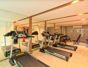 a gym with a bunch of exercise equipment in it at DusitD2 Hua Hin - One bedroom with a beautiful view of the garden and pool in Hua Hin