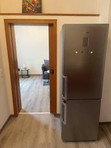 a kitchen with a refrigerator in a room at Großzügige Wohnung in Lüdenscheid