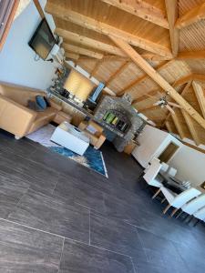 an overhead view of a living room with wooden ceilings at Villa De Luxe in Bihać