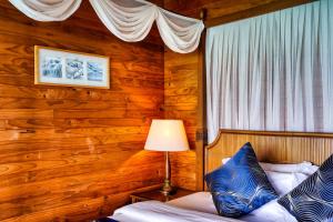 Postel nebo postele na pokoji v ubytování Fihalhohi Maldives