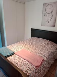 Кровать или кровати в номере Les Rosiers