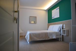 Posteľ alebo postele v izbe v ubytovaní Napoli Central Gate