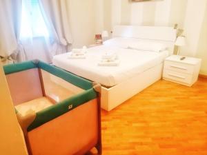 a small room with a bed and a night stand at Lovely Lucca [free parking] in Lucca