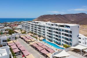 an aerial view of a resort with a pool at Oceanview Living Space & Balcony with FiberOptic WiFi! in La Paz