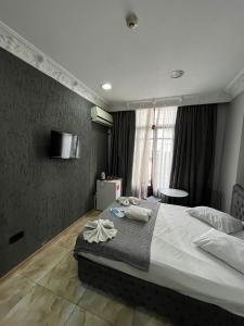 a bedroom with a large bed and a window at Nest HOTEL Sisli in Istanbul