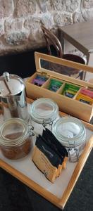 a tray with jars and other items on a table at Top Barn WALES in Monmouth