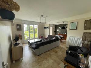 Χώρος καθιστικού στο Appartement spacieux. P gratuit.plage à 13 min