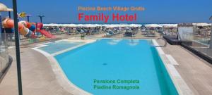 a swimming pool on a cruise ship with the words family hotel at Hotel Moresco - Piscina Beach Village in Riccione