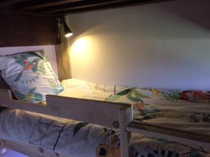 Una cama o camas en una habitación de Gite le ptit Corpatus