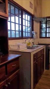 a kitchen with a sink and a counter top at Noelle’s House - Alto Boquete, a natural place to enjoy. in Alto Boquete
