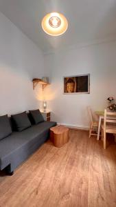 a living room with a couch and a table at Mini Home Ferienwohnung - Monteurzimmer in Cologne