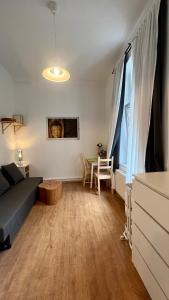 a living room with a couch and a table at Mini Home Ferienwohnung - Monteurzimmer in Cologne