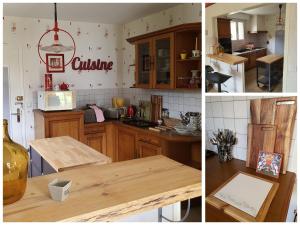 a kitchen with wooden cabinets and a table in it at TI GLAS in Tregueux